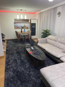 a living room with a couch and a table at Villa Green in Sarajevo