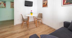 TV a/nebo společenská místnost v ubytování Ombra i Sol apartments