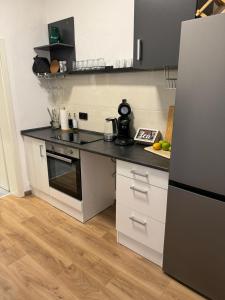 Kuchyň nebo kuchyňský kout v ubytování Apartment Goethe in der Göttinger Innenstadt + 3 fotografie