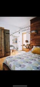 a bedroom with a bed and a desk in it at Chalet Epinel in Villaret