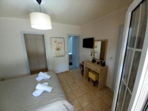 Postel nebo postele na pokoji v ubytování Villa Pythari + 3 fotografie