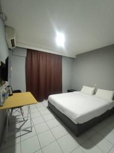 Un pat sau paturi într-o cameră la Hotel Iramanis
