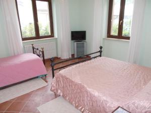 Un pat sau paturi într-o cameră la B&B Il Giardino Acquatico