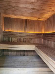 an empty sauna with wooden walls and wooden floors at The Fernglen Forest Retreat in Mount Dandenong
