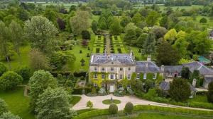 an aerial view of a large house with a garden at Alexis Cottage Tetbury Cotswolds in Tetbury