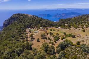 an aerial view of a mountain with a camping area at Babakamp Eco Ranch & Retreat in Muğla