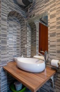 a bathroom with a large tub and a mirror at Barba Damir in Pag +53 photos