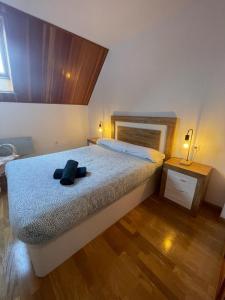 Ένα ή περισσότερα κρεβάτια σε δωμάτιο στο Apartamento Alba4
