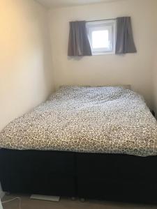 Postel nebo postele na pokoji v ubytování Uniek overnachten in een Tiny House op de Appelhof
