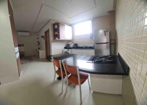 Kuchyň nebo kuchyňský kout v ubytování 6 Espaço tranquilo e confortável + 1 fotografie