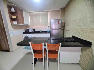 Virtuvė arba virtuvėlė apgyvendinimo įstaigoje 6 Espaço tranquilo e confortável