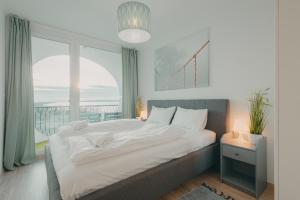 Postel nebo postele na pokoji v ubytování Cruiser Apartmanok Siófok By BLTN