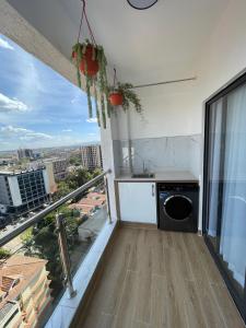 an apartment balcony with a view of a city at Smarthome Serviced Apartment in Nairobi