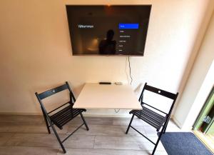 TV a/nebo společenská místnost v ubytování GEG Hotel