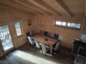 a dining room with a wooden table and chairs at Bergliebe Klippitztörl in Klippitztorl +60 photos