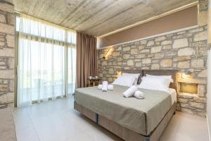 Ένα ή περισσότερα κρεβάτια σε δωμάτιο στο Achatis Apartments with sea view