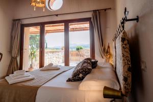 Postel nebo postele na pokoji v ubytování Agriturismo Giù al Pozzo