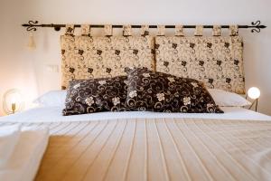 Postel nebo postele na pokoji v ubytování Agriturismo Giù al Pozzo