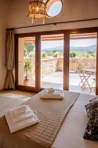 Postel nebo postele na pokoji v ubytování Agriturismo Giù al Pozzo