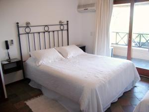 Postel nebo postele na pokoji v ubytování Hotel De La Barra