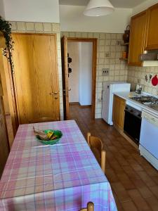 a kitchen with a table with a plate on it at Iria Chianti Home in Strada