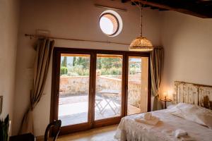 Postel nebo postele na pokoji v ubytování Agriturismo Giù al Pozzo