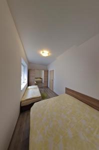 Postel nebo postele na pokoji v ubytování Apartmán 10