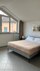 Giường trong phòng chung tại San Martino Holiday Apartments +40 ảnh