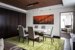 a dining room with a table and chairs at Hyatt Centric Midtown Atlanta in Atlanta