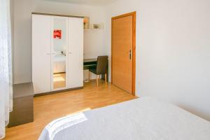 Giường trong phòng chung tại Apartments Etera