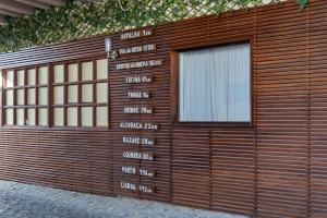 a wooden garage door with a window on it at Casa da Lena in Batalha