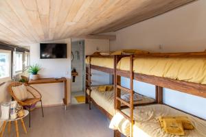 a room with two bunk beds and a table at Casa da Lena in Batalha +34 photos