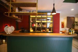 a bar with a green counter in a restaurant at ÇEVİK PALACE HOTEL in Antalya