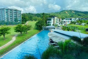 an aerial view of a river in a city at The Par Phuket SHA Plus in Kathu