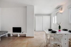 TV a/nebo společenská místnost v ubytování Apartamentos ALAZUL Extramuros