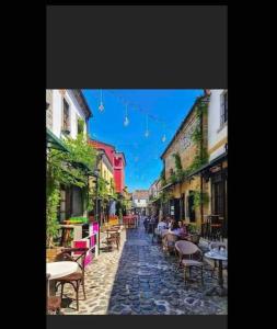 a picture of a street with tables and chairs at Traditional Bazaar Home2 in Korçë