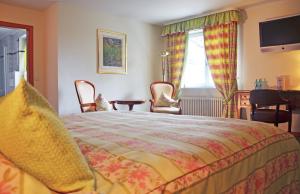 Postel nebo postele na pokoji v ubytování Hotel Mühle
