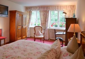 Postel nebo postele na pokoji v ubytování Hotel Mühle