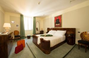 Postel nebo postele na pokoji v ubytování Hotel Gregoriana + 23 fotografií
