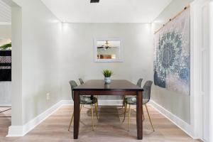 a dining room with a table and chairs at Relaxing Bungalow Walkable to the Beach! in St Pete Beach