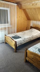 Postel nebo postele na pokoji v ubytování Eco Sadyba Chertizh + 37 fotografií