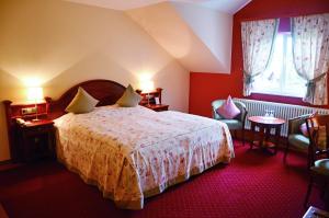 Postel nebo postele na pokoji v ubytování Hotel Mühle