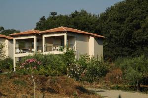 a house on top of a hill with trees at Tenuta Madonnina in Castiglione di Sicilia