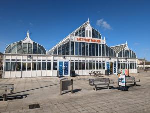 a large building with a sign that reads last point market at Luxury Penthouse Apartment in Lowestoft