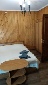 Postel nebo postele na pokoji v ubytování Eco Sadyba Chertizh