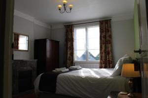 Кровать или кровати в номере Le Clos Castel