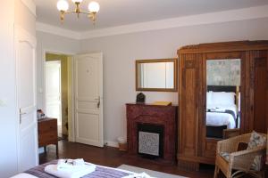 Postel nebo postele na pokoji v ubytování Le Clos Castel