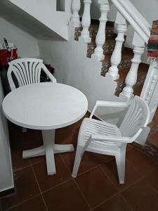 Posezení v ubytování Rincón de Joel Habitación con baño privado