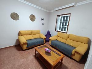 Posezení v ubytování Rincón de Joel Habitación con baño privado