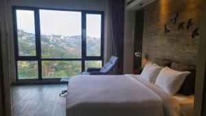 Postel nebo postele na pokoji v ubytování The Luxe Da Lat